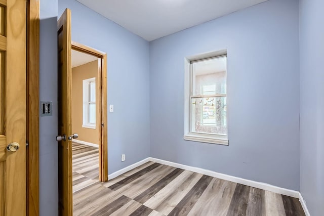 8151 S Bennett Ave, Chicago, IL 60617 - spare room featuring baseboards and wood finished floors