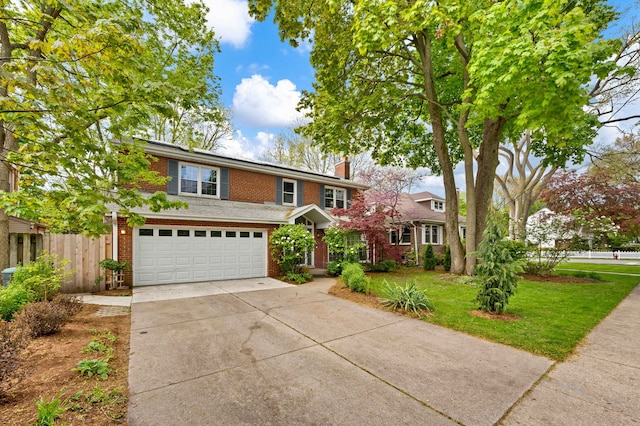 traditional-style home with brick siding, driveway, a garage, and a chimney