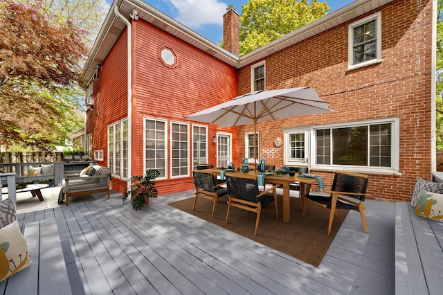 wooden deck with outdoor dining area