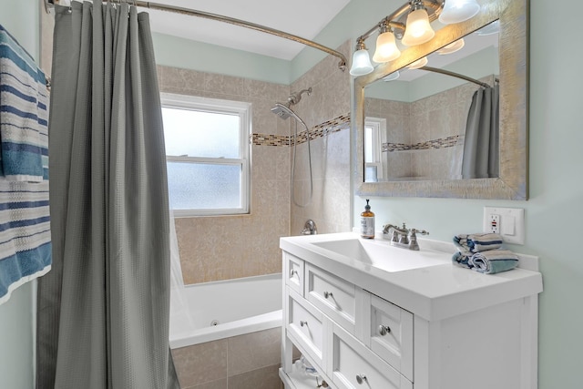 bathroom with vanity and tiled shower / bath combo