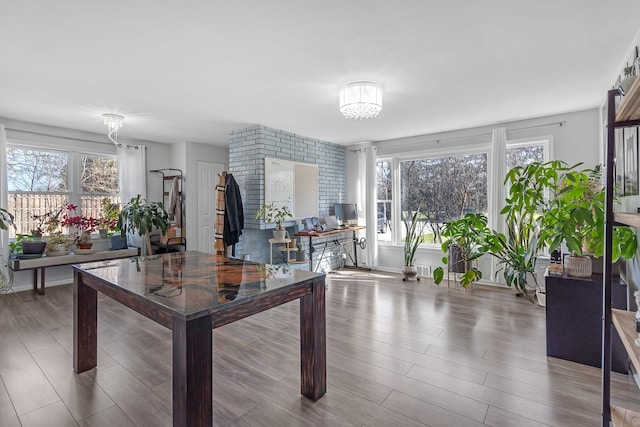 interior space with a chandelier and wood finished floors
