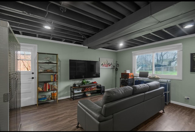 living room featuring baseboards and wood finished floors