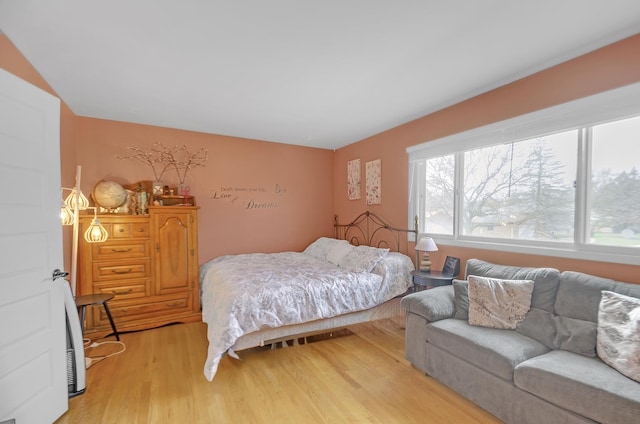 bedroom with light wood-style floors
