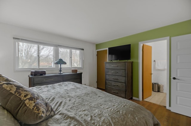 bedroom with wood finished floors