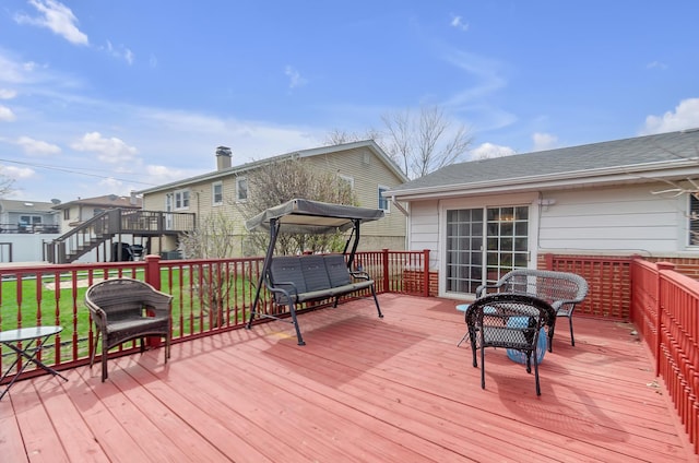 wooden terrace featuring a residential view