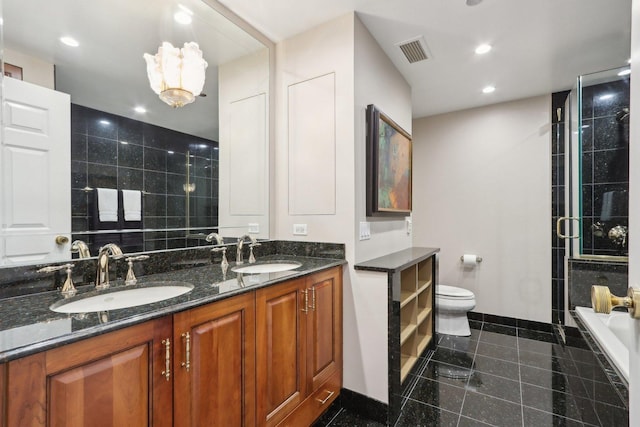 bathroom featuring a sink, recessed lighting, granite finish floor, and visible vents