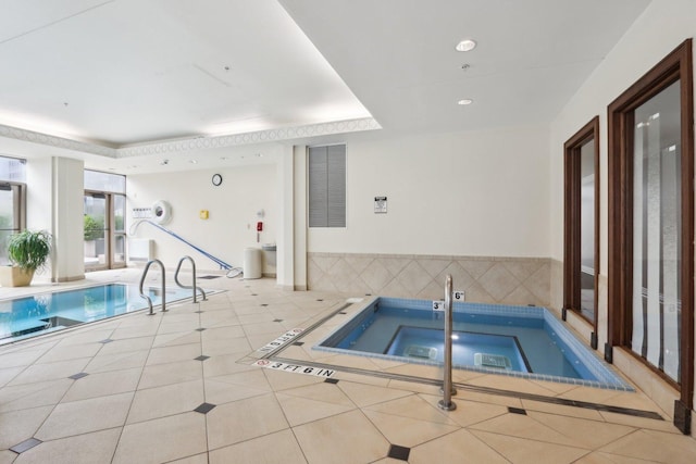 view of swimming pool featuring an indoor in ground hot tub