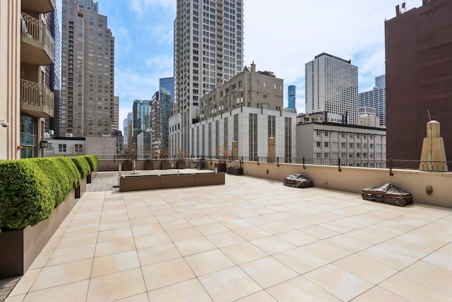 view of patio / terrace featuring a city view