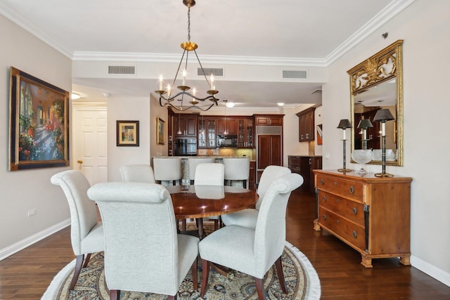 dining area with a chandelier, visible vents, and dark wood-type flooring