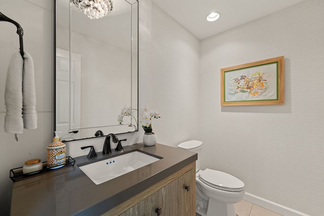 half bathroom with toilet, tile patterned floors, recessed lighting, and vanity