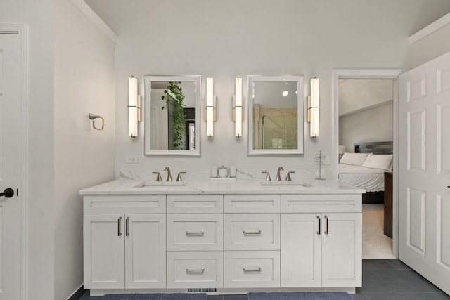 bathroom featuring a sink, ensuite bathroom, walk in shower, and double vanity