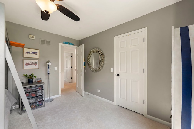 bedroom featuring baseboards, carpet, a ceiling fan, and visible vents