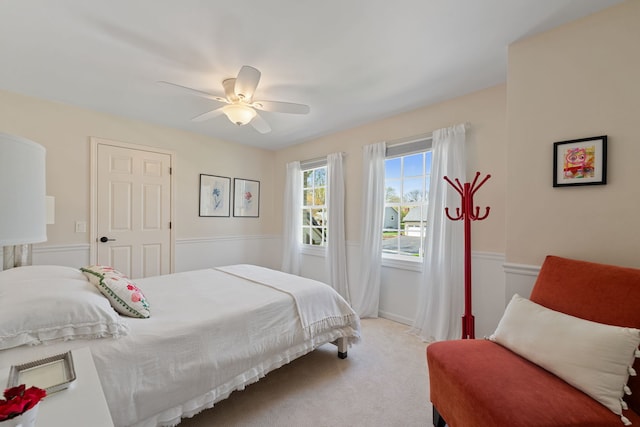 carpeted bedroom with a ceiling fan
