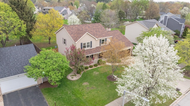 birds eye view of property with a residential view