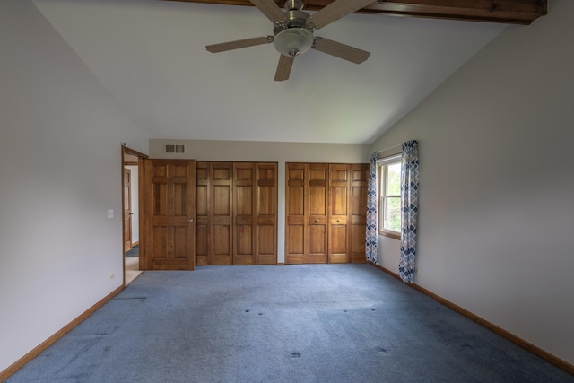 unfurnished bedroom featuring visible vents, multiple closets, baseboards, a ceiling fan, and carpet