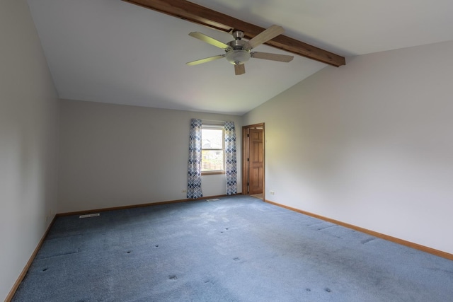unfurnished room featuring a ceiling fan, baseboards, lofted ceiling with beams, and carpet