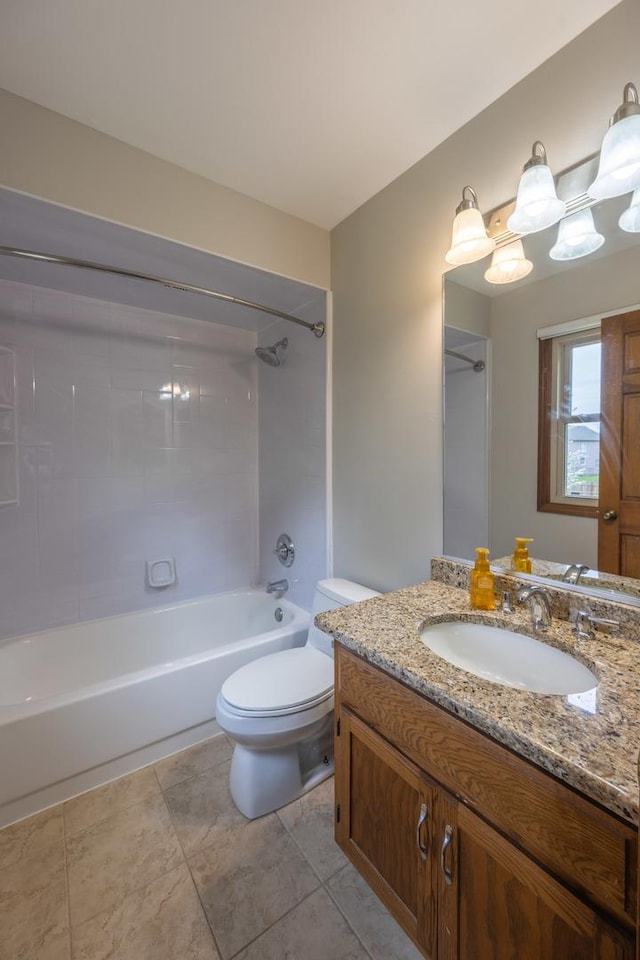 bathroom with vanity, bathtub / shower combination, and toilet