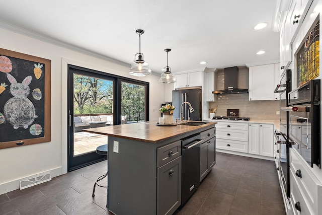 506 Aberdeen Rd, Frankfort, IL 60423 - kitchen with wall chimney exhaust hood, white cabinets, dishwasher, a kitchen island with sink, and wooden counters