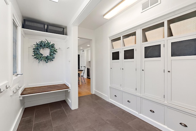 506 Aberdeen Rd, Frankfort, IL 60423 - mudroom with dark tile patterned flooring and baseboards