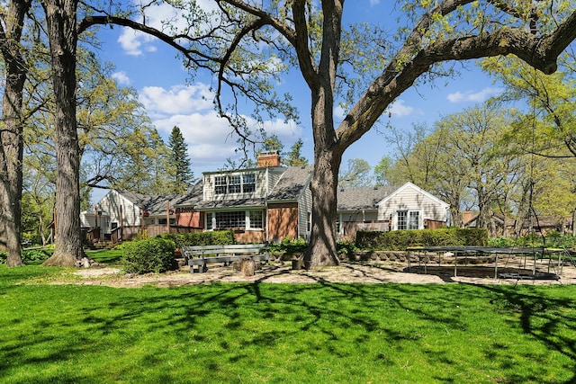 506 Aberdeen Rd, Frankfort, IL 60423 - rear view of property featuring a chimney and a yard