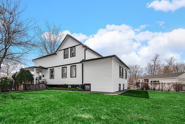 824 Rowlett Ave, Melrose Park, IL 60164 - rear view of property with a yard