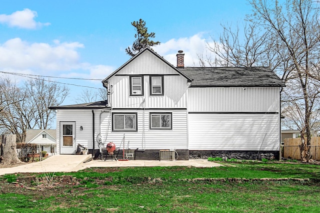 824 Rowlett Ave, Melrose Park, IL 60164 - back of house with a patio, a yard, fence, and a chimney