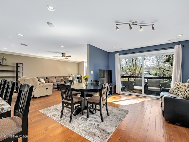 dining space with hardwood / wood-style floors, visible vents, a ceiling fan, and recessed lighting