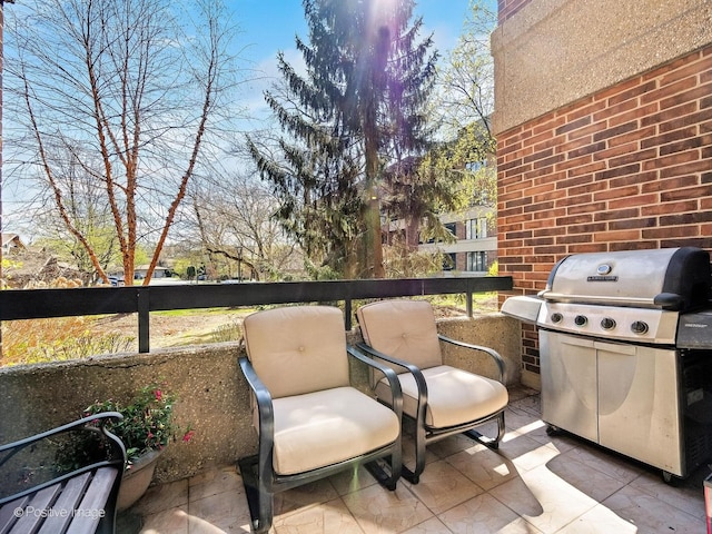 balcony with a patio area and a grill