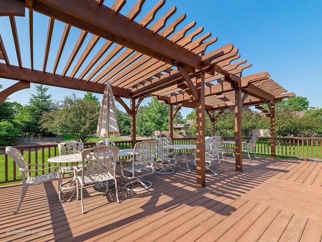 wooden deck featuring outdoor dining area and a pergola