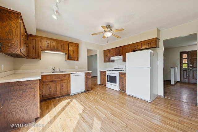 full bathroom with vanity, toilet, tile walls, shower / washtub combination, and wood finished floors