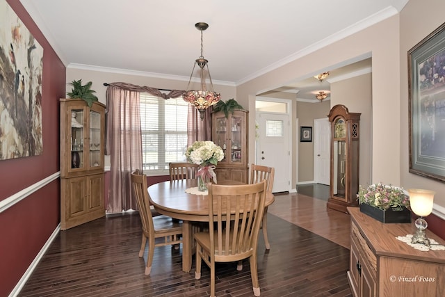 459 E Amberside Dr, Elgin, IL 60124 - dining room featuring dark wood finished floors, ornamental molding, and plenty of natural light