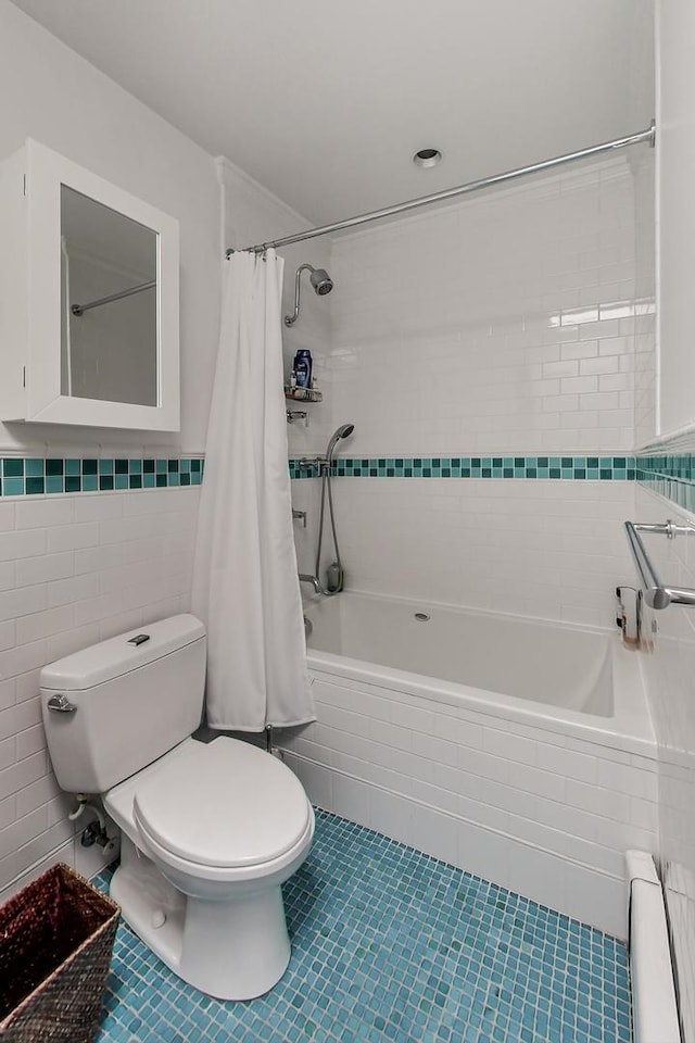351 W Belden Ave, Chicago, IL 60614 - full bathroom with toilet, tile walls, baseboard heating, tiled shower / bath combo, and tile patterned flooring