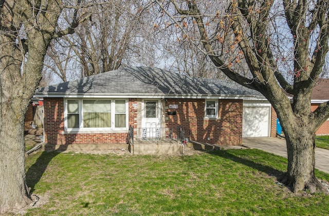 view of front of home with brick siding, a front lawn, an attached garage, and concrete driveway