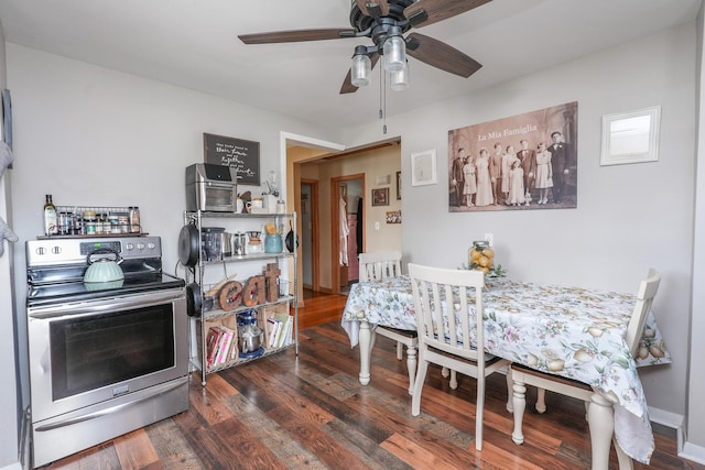 dining area featuring a ceiling fan and wood finished floors
