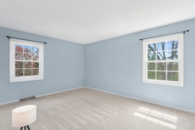 1212 Brighton Rd, Naperville, IL 60563 - spare room with visible vents, baseboards, light carpet, and a healthy amount of sunlight