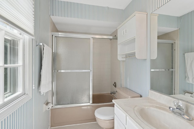 1212 Brighton Rd, Naperville, IL 60563 - full bathroom featuring wallpapered walls, vanity, bath / shower combo with glass door, toilet, and tile patterned flooring