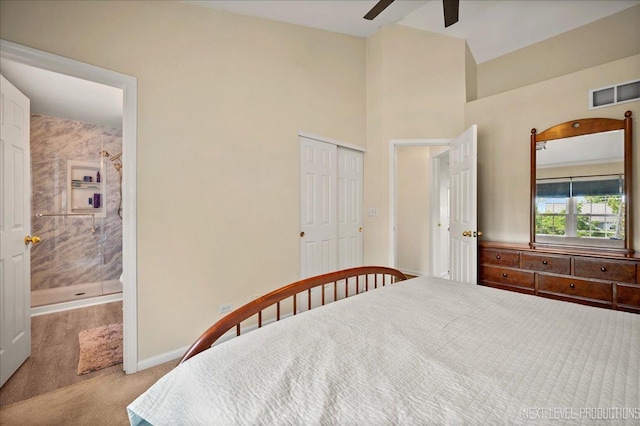 19 Vernon Ct, South Elgin, IL 60177 - carpeted bedroom featuring a closet, ceiling fan, ensuite bathroom, and high vaulted ceiling