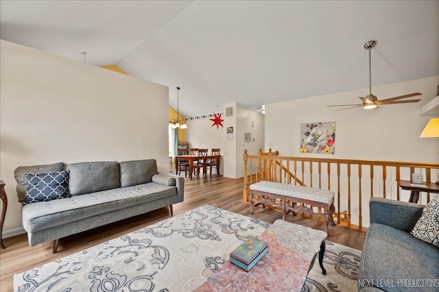 19 Vernon Ct, South Elgin, IL 60177 - living room with lofted ceiling, a ceiling fan, wood finished floors, and a chandelier