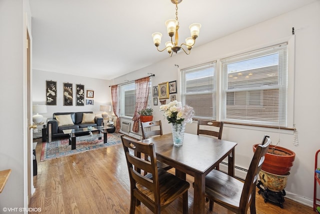 205 Circle Ave Unit 2B, Forest Park, IL 60130 - dining space featuring a chandelier and light wood finished floors