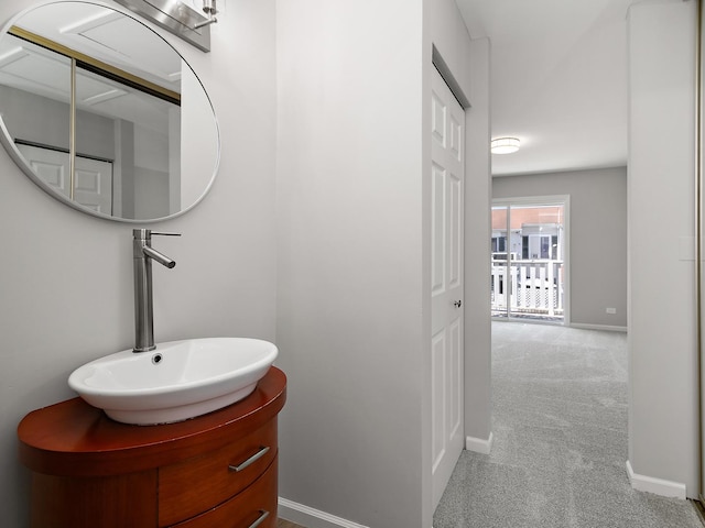 bathroom featuring a sink and baseboards