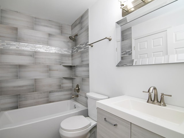 full bathroom with toilet, vanity, and washtub / shower combination