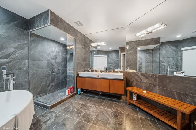 14567 S 82nd Ave, Orland Park, IL 60462 - bathroom with a sink, tiled shower, tile walls, visible vents, and a freestanding tub