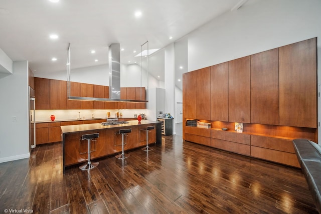 14567 S 82nd Ave, Orland Park, IL 60462 - kitchen featuring stainless steel gas stovetop, dark wood-style floors, exhaust hood, a breakfast bar, and modern cabinets