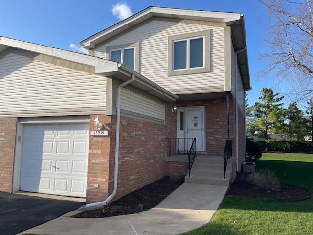 15939 Blackwater Ct, Tinley Park, IL 60477 - view of front facade featuring brick siding and an attached garage