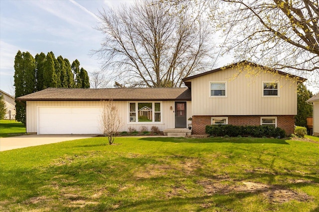 tri-level home featuring an attached garage, driveway, and a front yard