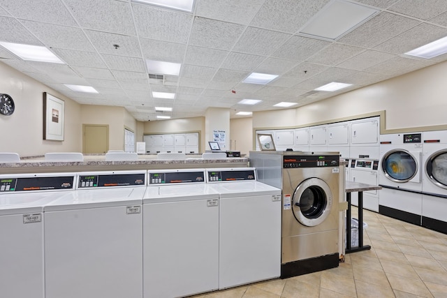 3660 N Lake Shore Dr Unit 711, Chicago, IL 60613 - common laundry area featuring washing machine and clothes dryer, light tile patterned flooring, and visible vents