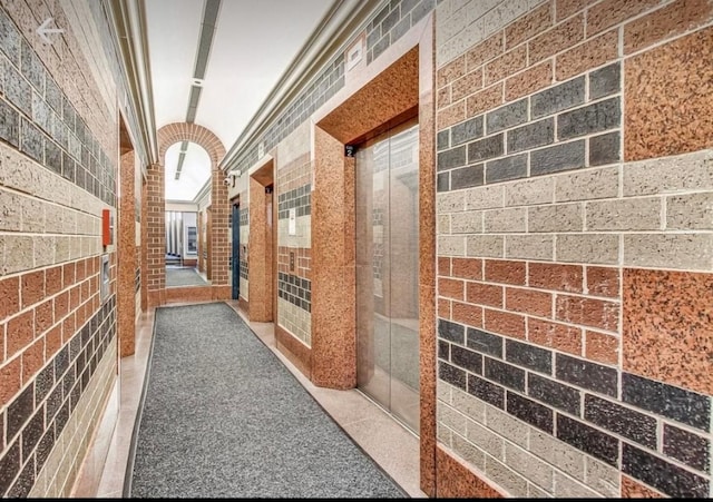 3660 N Lake Shore Dr Unit 711, Chicago, IL 60613 - corridor featuring lofted ceiling and tile walls