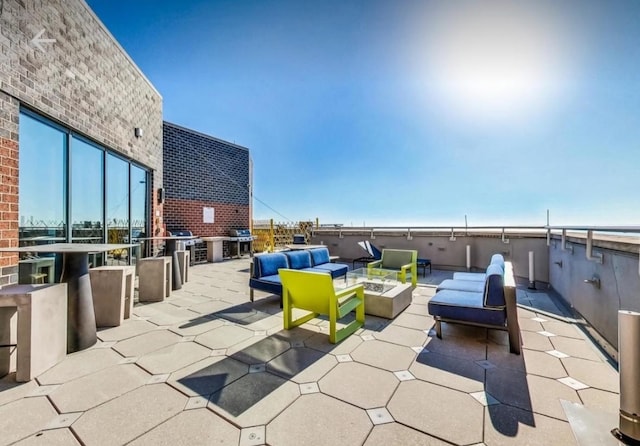 3660 N Lake Shore Dr Unit 711, Chicago, IL 60613 - view of patio / terrace with an outdoor living space with a fire pit and area for grilling