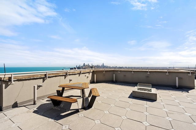 3660 N Lake Shore Dr Unit 711, Chicago, IL 60613 - view of patio with a fire pit and a water view
