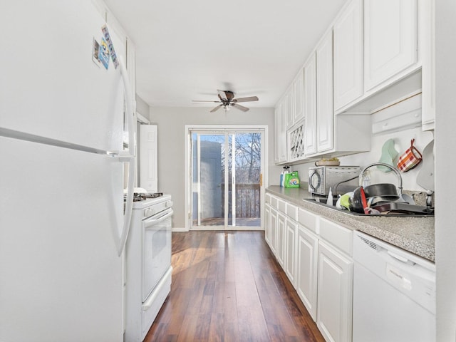 kitchen featuring ceiling fan, white appliances, dark wood-style flooring, light countertops, and a sink